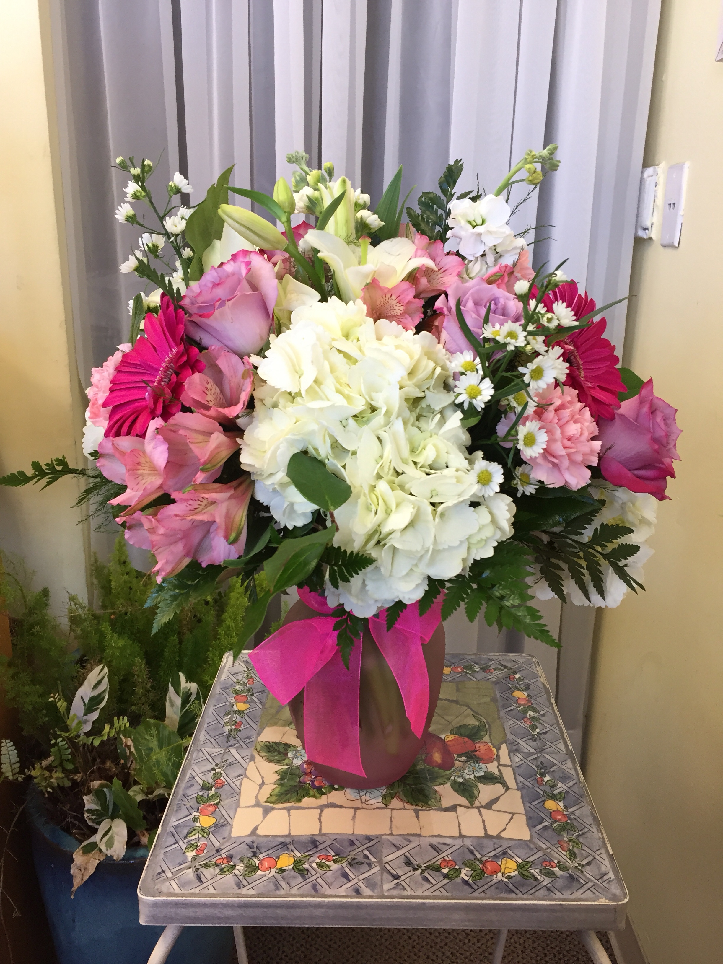Pink flower arrangement with Roses Hydrangea and Lilies